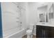Clean bathroom featuring a shower and dark vanity with white sink at 5936 Bruselas St, Las Vegas, NV 89113