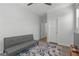 Comfortable bedroom with a soft couch, ceiling fan, and wood-style flooring at 5936 Bruselas St, Las Vegas, NV 89113