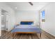 Inviting bedroom with wood floors, natural light, and a neutral color palette for a serene atmosphere at 5936 Bruselas St, Las Vegas, NV 89113