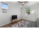 Cozy bedroom with a ceiling fan, a window, and a comfortable couch at 5936 Bruselas St, Las Vegas, NV 89113