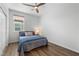 Well-lit bedroom with wood floors and a large window view at 5936 Bruselas St, Las Vegas, NV 89113