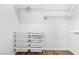Walk-in closet with custom shelving, drawers, and ample storage solutions, designed for organization and convenience at 5936 Bruselas St, Las Vegas, NV 89113