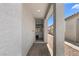 Inviting front door view with a peek into the home's interior at 5936 Bruselas St, Las Vegas, NV 89113