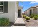 Close-up of the front entrance with a paved walkway and manicured shrubs at 5936 Bruselas St, Las Vegas, NV 89113