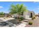 Charming single-story home featuring desert landscaping and a well-manicured front yard at 5936 Bruselas St, Las Vegas, NV 89113