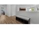 Hallway featuring wood floors and a bench with storage underneath at 5936 Bruselas St, Las Vegas, NV 89113