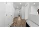 Bright hallway with wood floors leading to other rooms in the home at 5936 Bruselas St, Las Vegas, NV 89113