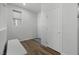 Hallway featuring wood floors and a storage bench at 5936 Bruselas St, Las Vegas, NV 89113