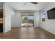 Bright living area with wood flooring and sliding glass doors to the outdoor patio at 5936 Bruselas St, Las Vegas, NV 89113