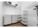 Organized walk-in closet with shelves and drawers, great for storage at 5936 Bruselas St, Las Vegas, NV 89113
