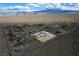 Expansive aerial view of desert home site highlighting the property's serene and secluded location and mountain views at 5950 Mojave St, Pahrump, NV 89061