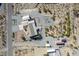 Birds-eye view of a house with sheds, desert landscaping, and wide open space at 5950 Mojave St, Pahrump, NV 89061