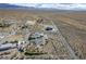 Distant aerial view shows a home and desert landscape at 5950 Mojave St, Pahrump, NV 89061