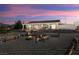A charming backyard with a firepit, multiple seating areas, and views of the mountains at 5950 Mojave St, Pahrump, NV 89061