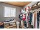 Spacious walk-in closet with built-in shelves and clothing racks, organized storage, and natural light from the window at 5950 Mojave St, Pahrump, NV 89061