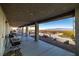 Covered patio offers shade and seating with views of the surrounding landscape and mountains at 5950 Mojave St, Pahrump, NV 89061