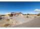 This beautiful property includes a covered carport, desert landscaping, and mountain views at 5950 Mojave St, Pahrump, NV 89061