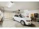 Clean garage with a white car parked inside and the garage door visible at 5950 Mojave St, Pahrump, NV 89061