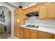 Kitchen showcasing wood cabinets, modern countertops and stovetop at 5950 Mojave St, Pahrump, NV 89061