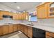 Updated kitchen with wooden cabinetry and stainless steel appliances at 5950 Mojave St, Pahrump, NV 89061