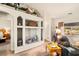 Bright living room features built-in shelves and a comfortable recliner at 5950 Mojave St, Pahrump, NV 89061