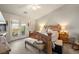 Bright main bedroom features French doors and a ceiling fan at 5950 Mojave St, Pahrump, NV 89061
