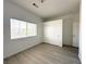 Bedroom with bright natural light, built-in closet, and modern flooring, offering a comfortable and inviting atmosphere at 6571 Abalone Shell Ct, Las Vegas, NV 89139