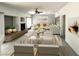 Bright living room featuring stylish decor, a glass dining table and comfortable sofas at 6571 Abalone Shell Ct, Las Vegas, NV 89139