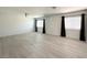 Spacious living area with hardwood floors, recessed lighting, and large windows at 6571 Abalone Shell Ct, Las Vegas, NV 89139