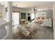Bright living room area featuring a glass dining table and comfortable seating at 6571 Abalone Shell Ct, Las Vegas, NV 89139