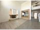 Open floor plan of a living room featuring sleek floors and a unique fireplace at 6571 Abalone Shell Ct, Las Vegas, NV 89139