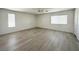 Spacious living room with modern flooring and abundant natural light streaming through the bright windows at 6571 Abalone Shell Ct, Las Vegas, NV 89139