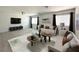 Inviting living room with neutral walls, modern furnishings, and plenty of natural light at 6571 Abalone Shell Ct, Las Vegas, NV 89139