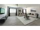 Stylishly furnished living room showcasing hardwood floors, neutral tones, and ample space at 6571 Abalone Shell Ct, Las Vegas, NV 89139