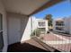 Cozy balcony with metal railing and views of nearby buildings and landscaping at 6800 E Lake Mead Blvd # 2024, Las Vegas, NV 89156