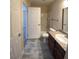 Bright bathroom with a toilet, vanity and tiled floor at 6800 E Lake Mead Blvd # 2024, Las Vegas, NV 89156