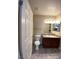 Bright bathroom with a toilet, vanity and tiled floor at 6800 E Lake Mead Blvd # 2024, Las Vegas, NV 89156