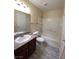 Cozy bathroom featuring wood-look floors, tub/shower combo, and vanity at 6800 E Lake Mead Blvd # 2024, Las Vegas, NV 89156