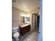 Bright bathroom with a toilet, vanity and tiled floor at 6800 E Lake Mead Blvd # 2024, Las Vegas, NV 89156