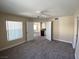 Spacious bedroom with a ceiling fan, carpeted floors, and access to other rooms at 6800 E Lake Mead Blvd # 2024, Las Vegas, NV 89156