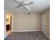 Neutral bedroom with a ceiling fan and carpeted flooring at 6800 E Lake Mead Blvd # 2024, Las Vegas, NV 89156