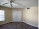 Neutral bedroom with a carpeted floor, ceiling fan, and closet at 6800 E Lake Mead Blvd # 2024, Las Vegas, NV 89156