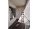Exterior view of a condo entrance featuring a white front door, window, security features and a wall mounted fire extinguisher at 6800 E Lake Mead Blvd # 2024, Las Vegas, NV 89156