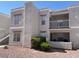 Condo exterior with multiple windows, a balcony, and a well-maintained, xeriscaped front yard with desert landscaping at 6800 E Lake Mead Blvd # 2024, Las Vegas, NV 89156