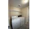 Bright laundry room with storage shelf, washer and dryer at 6800 E Lake Mead Blvd # 2024, Las Vegas, NV 89156