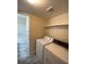 Bright laundry room with storage shelf, washer and dryer at 6800 E Lake Mead Blvd # 2024, Las Vegas, NV 89156