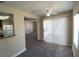 Bright living room with carpet, ceiling fan, and sliding door for natural light at 6800 E Lake Mead Blvd # 2024, Las Vegas, NV 89156