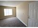 Inviting living room featuring neutral walls, modern carpet, and natural light streaming through window blinds at 6800 E Lake Mead Blvd # 2024, Las Vegas, NV 89156