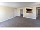 Open-concept living room with neutral walls and new carpeting offers seamless transition to kitchen and other rooms at 6800 E Lake Mead Blvd # 2024, Las Vegas, NV 89156