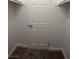 A tidy walk-in closet is shown with shelving and a closed white paneled door at 6800 E Lake Mead Blvd # 2024, Las Vegas, NV 89156
